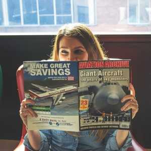 Etaoin, Business Director, reads a magazine