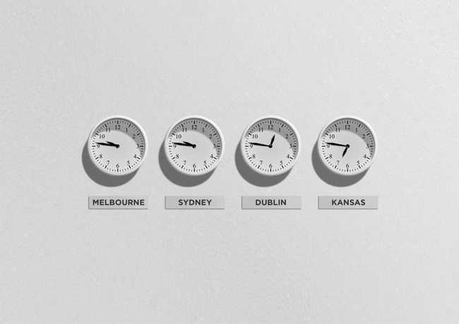 Four clocks showing the time in Sydney, Melbourne, Dublin and Kansas