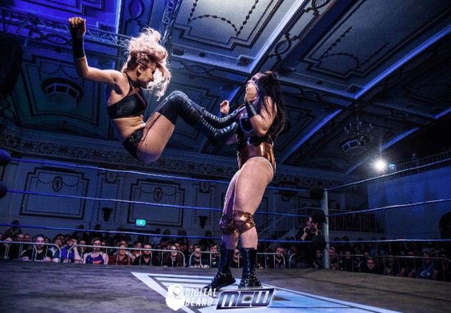Two women compete in a wrestling match
